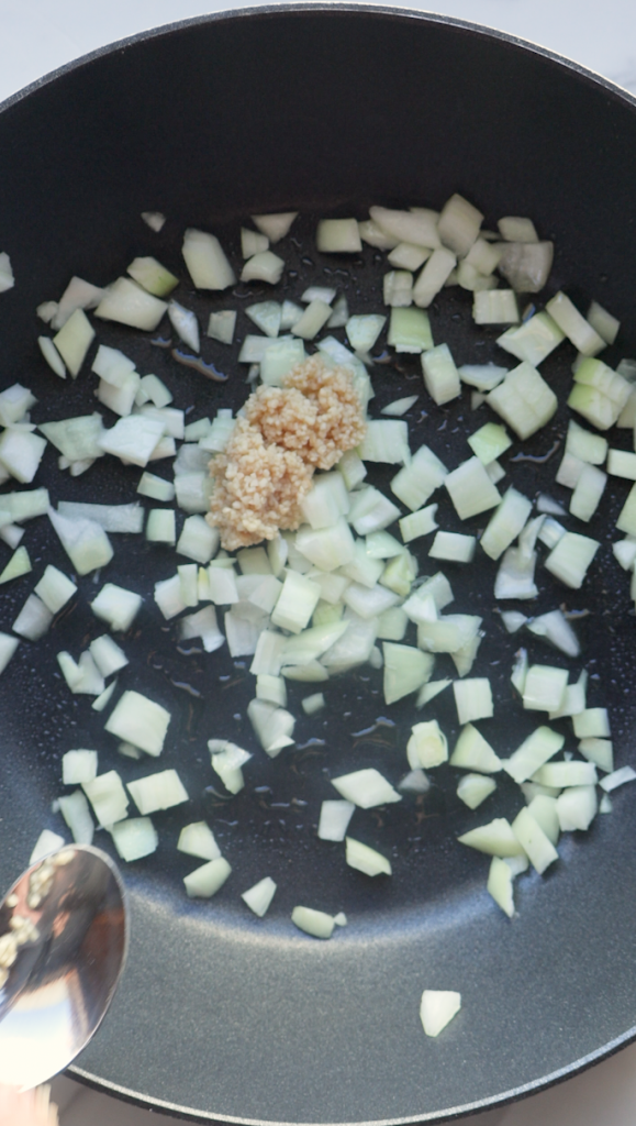 diced onion and garlic with the gulpea korma